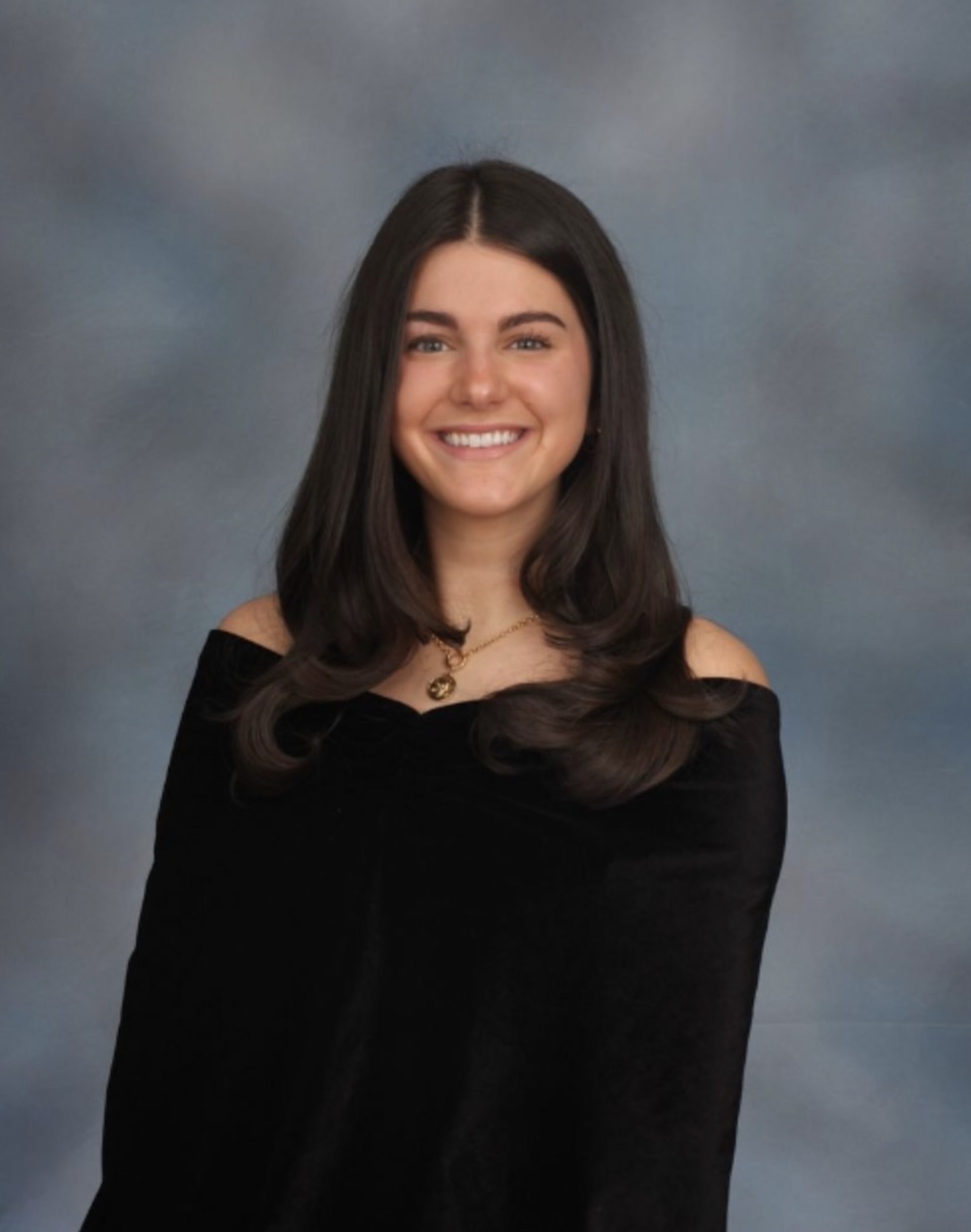 professional portrait photograph of woman with long dark hair and black dress.